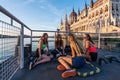 Girls talking on the pier in front of the Parliament #817