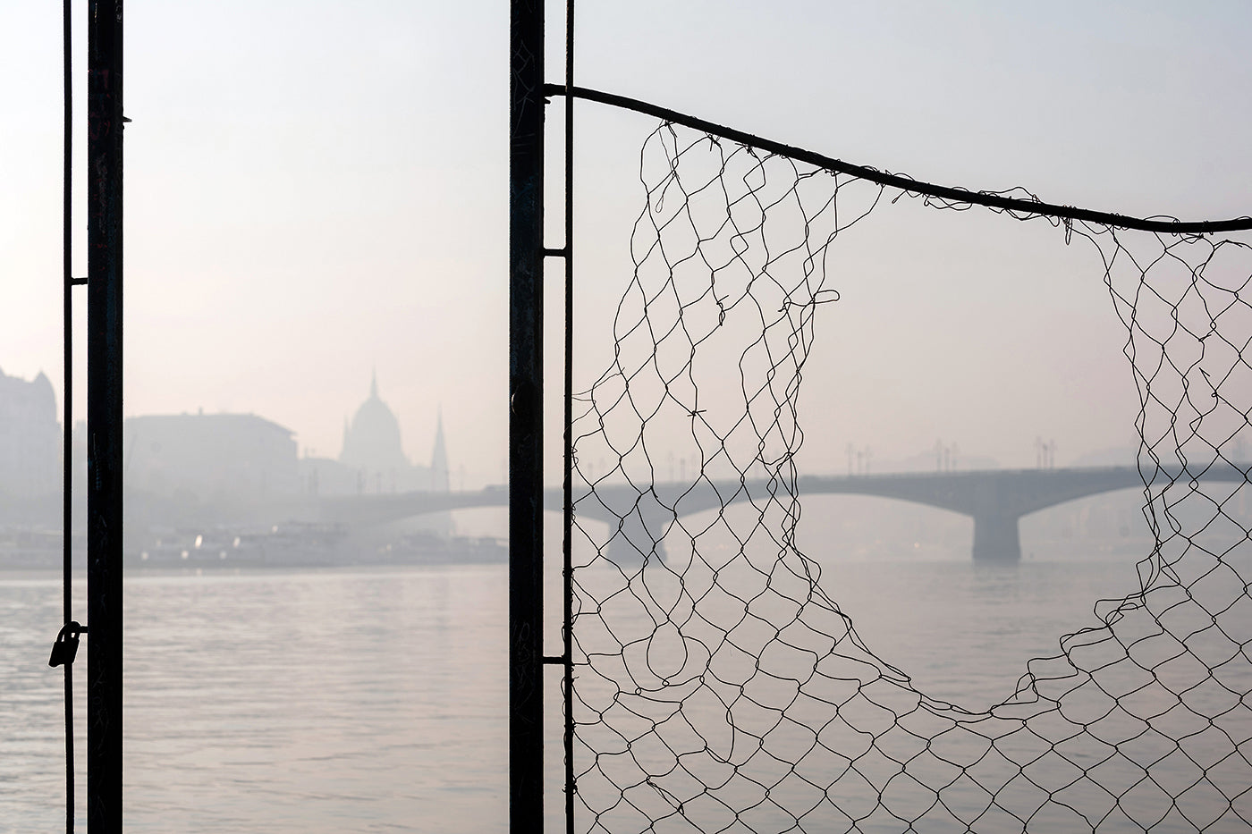 Budapest skyline through a wire fence #1876